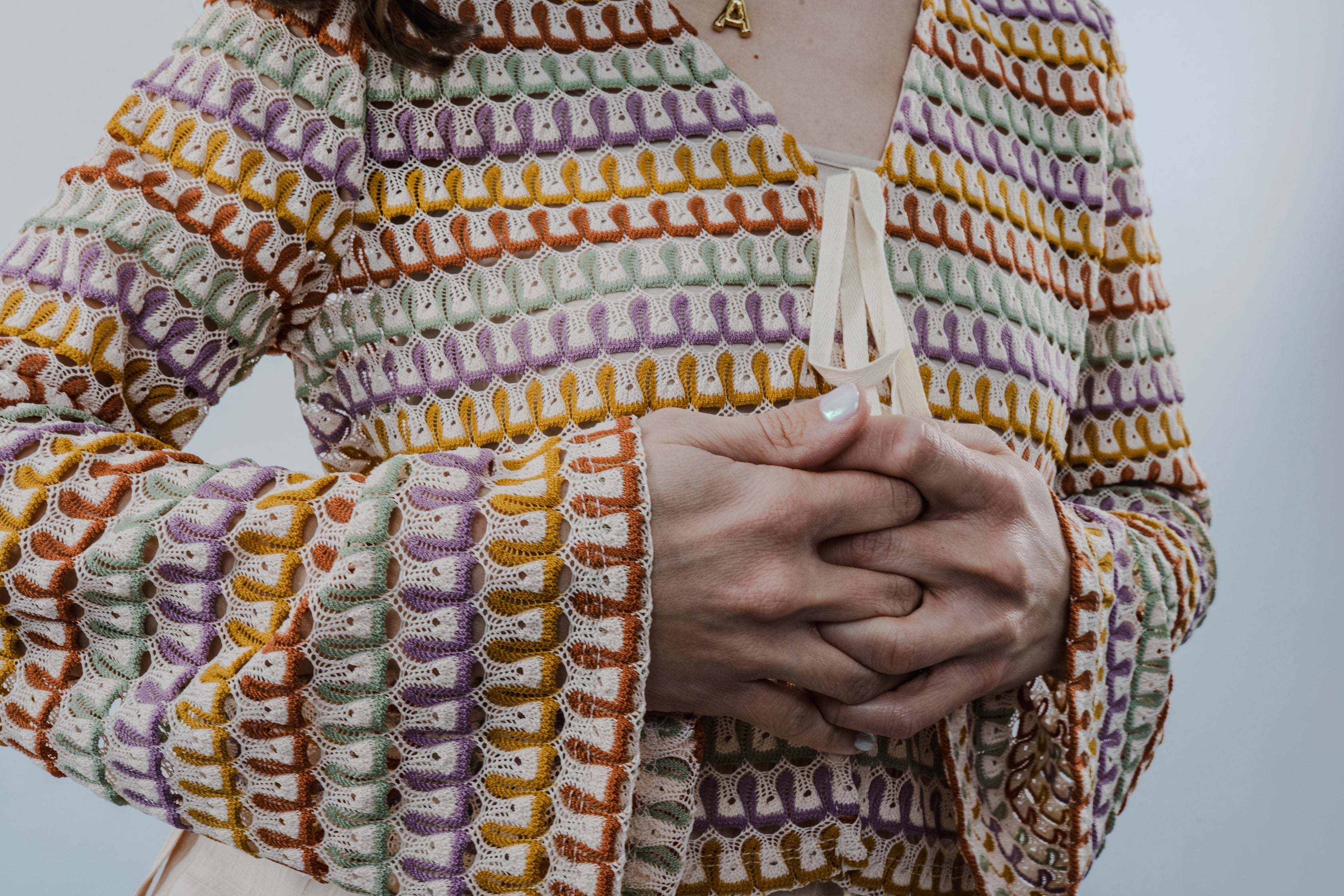 Close-up of the textured crochet pattern on The Heirloom Crochet Cardigan.