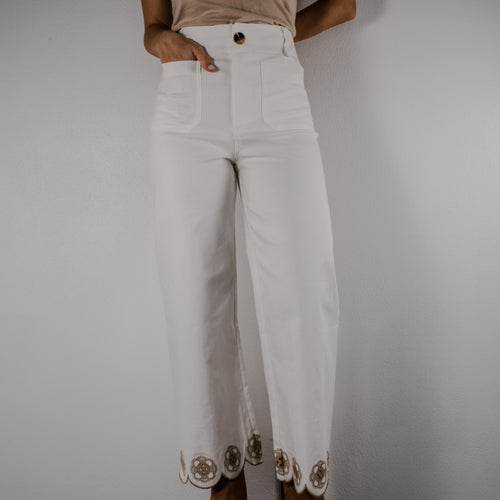 Full-length view of the Gentle Bloom scalloped wide-leg pants in a true white with shadows, featuring a relaxed fit and delicate scalloped hemline.