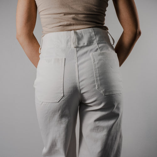 Rear view of the Gentle Bloom wide-leg pants showing the smooth waistband and flowy fabric drape.