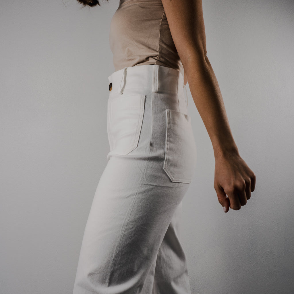 Close-up of the side view of the Gentle Bloom wide-leg pants. Shows belt loops and pockets and relaxed fit.