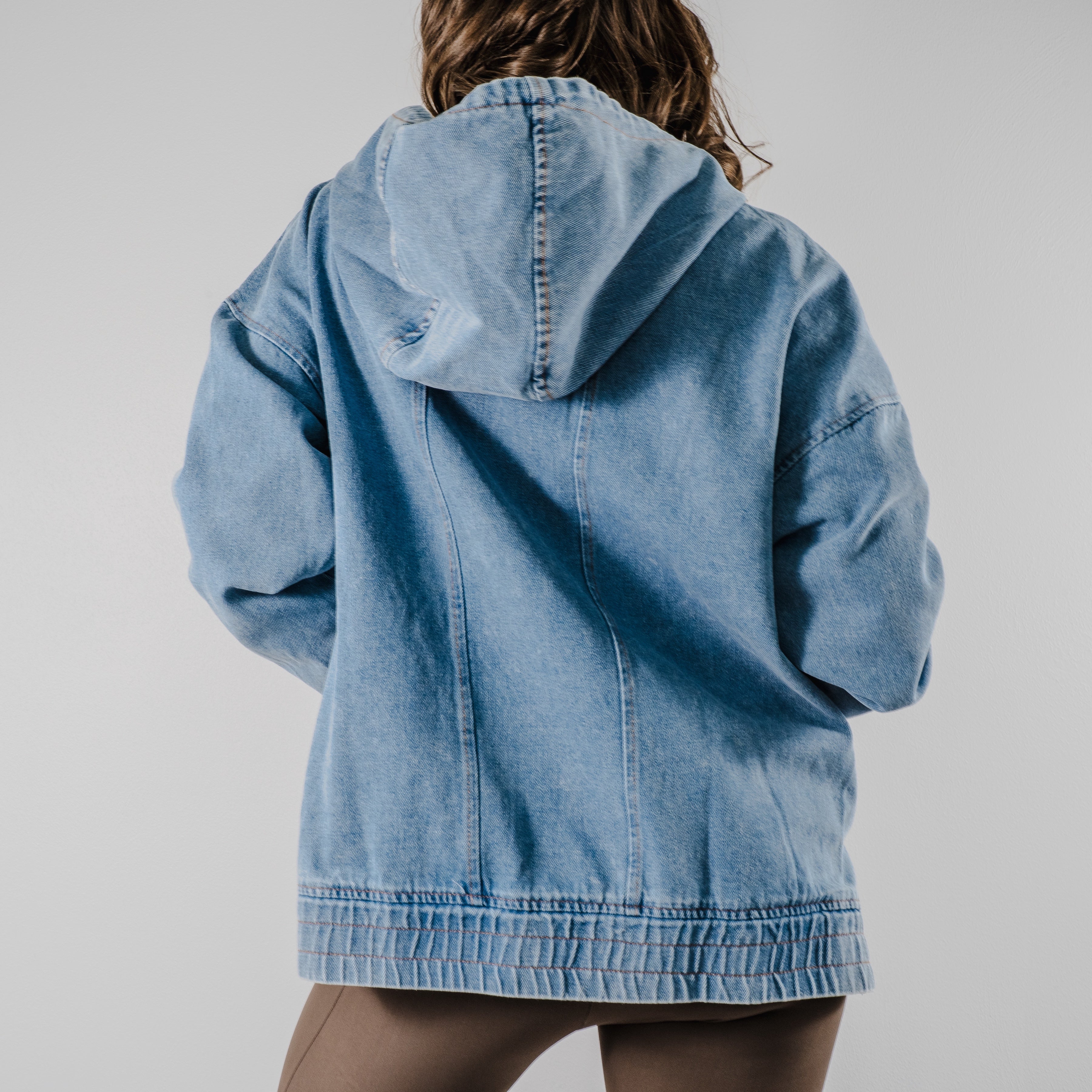 Back view of the model showing the hood of the "Denim Daze Hoodie".