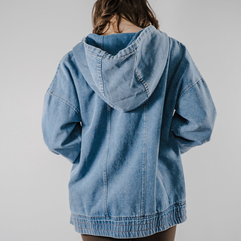 Back view of the model showing the hood of the "Denim Daze Hoodie".
