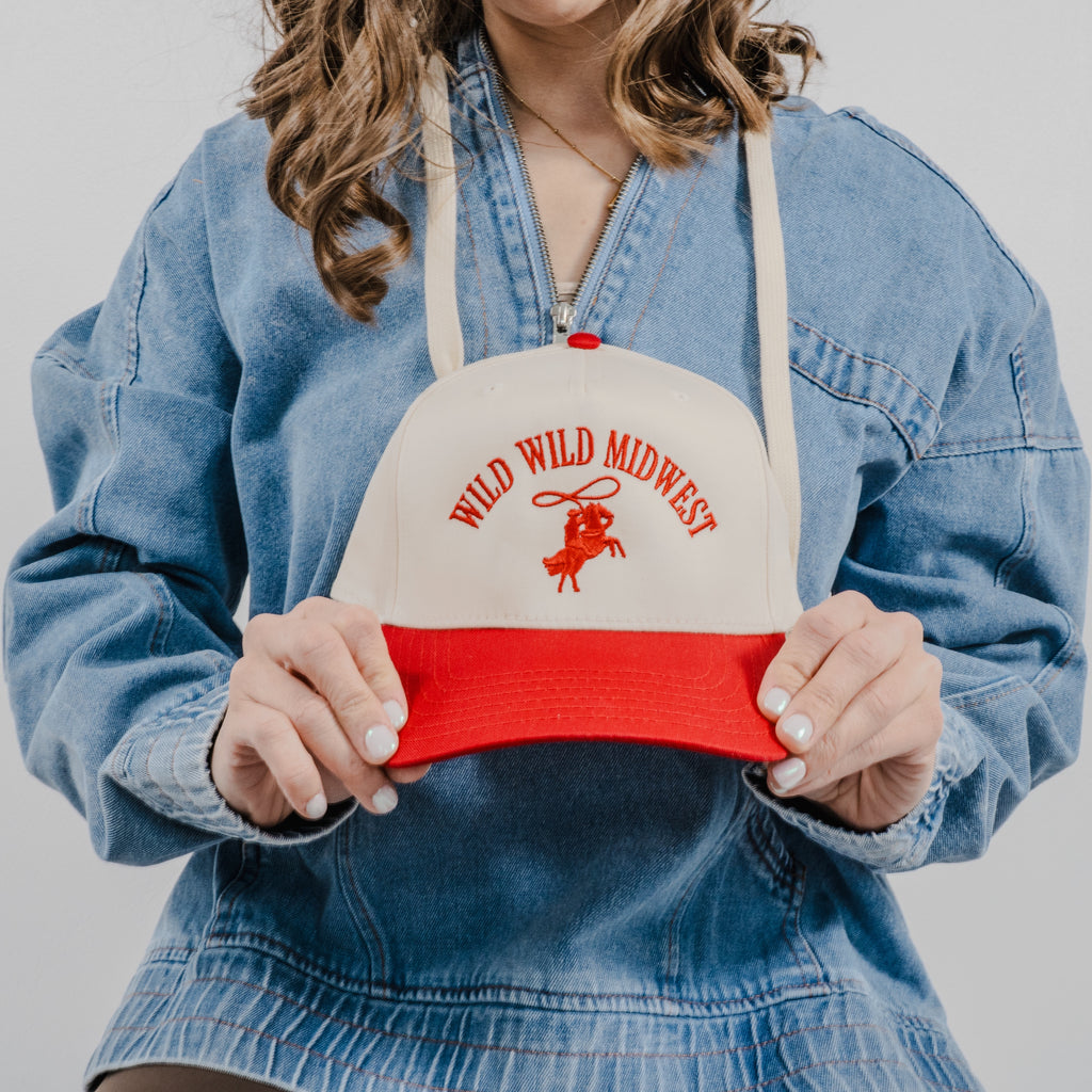 Close up of the Wild Wild Midwest Hat in beige and red with multi-colored western style embroidery.