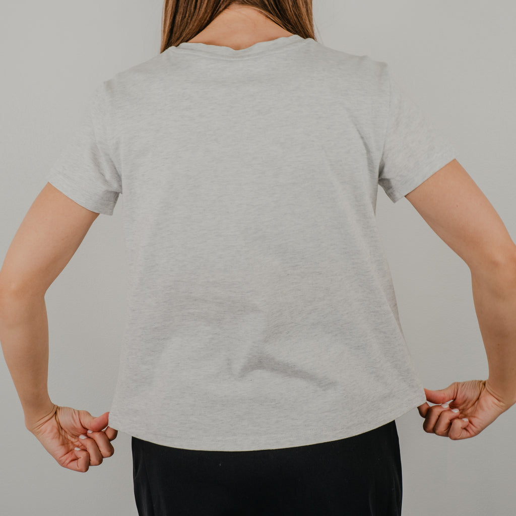Back view of the light heathered grey Basic Bra Tee showing the clean, seamless design and comfortable crew neckline.