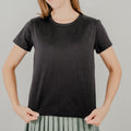 Front view of a black short-sleeve 'Basic Bra Tee' featuring a built-in shelf bra and a flattering, form-fitting silhouette.