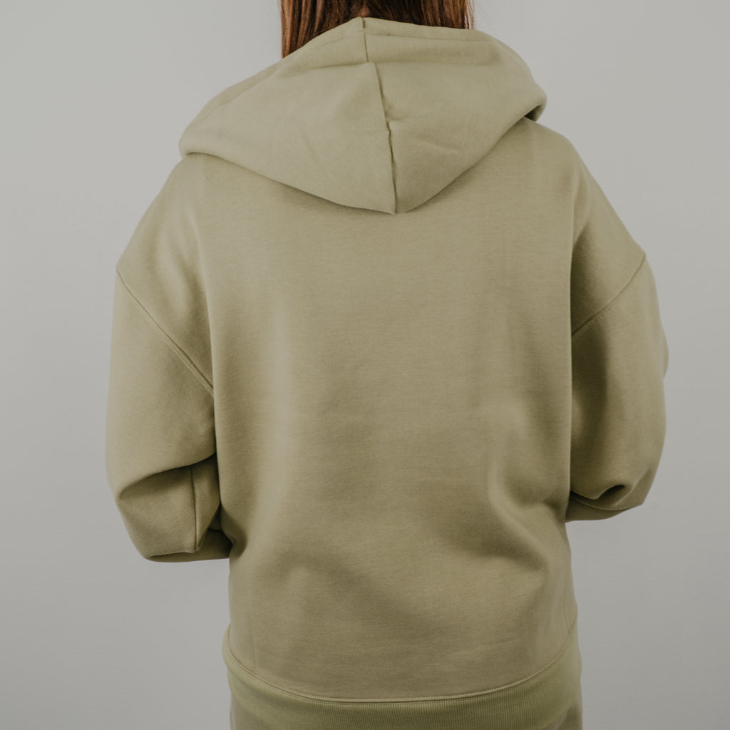 Rear view of the Jet Set Zip Up Hoodie showing the relaxed, slouchy fit and large structured hood.